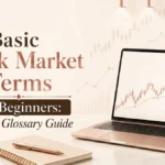 Basic stock market terms for beginners shown with laptop chart, notebook, and simple glossary guide